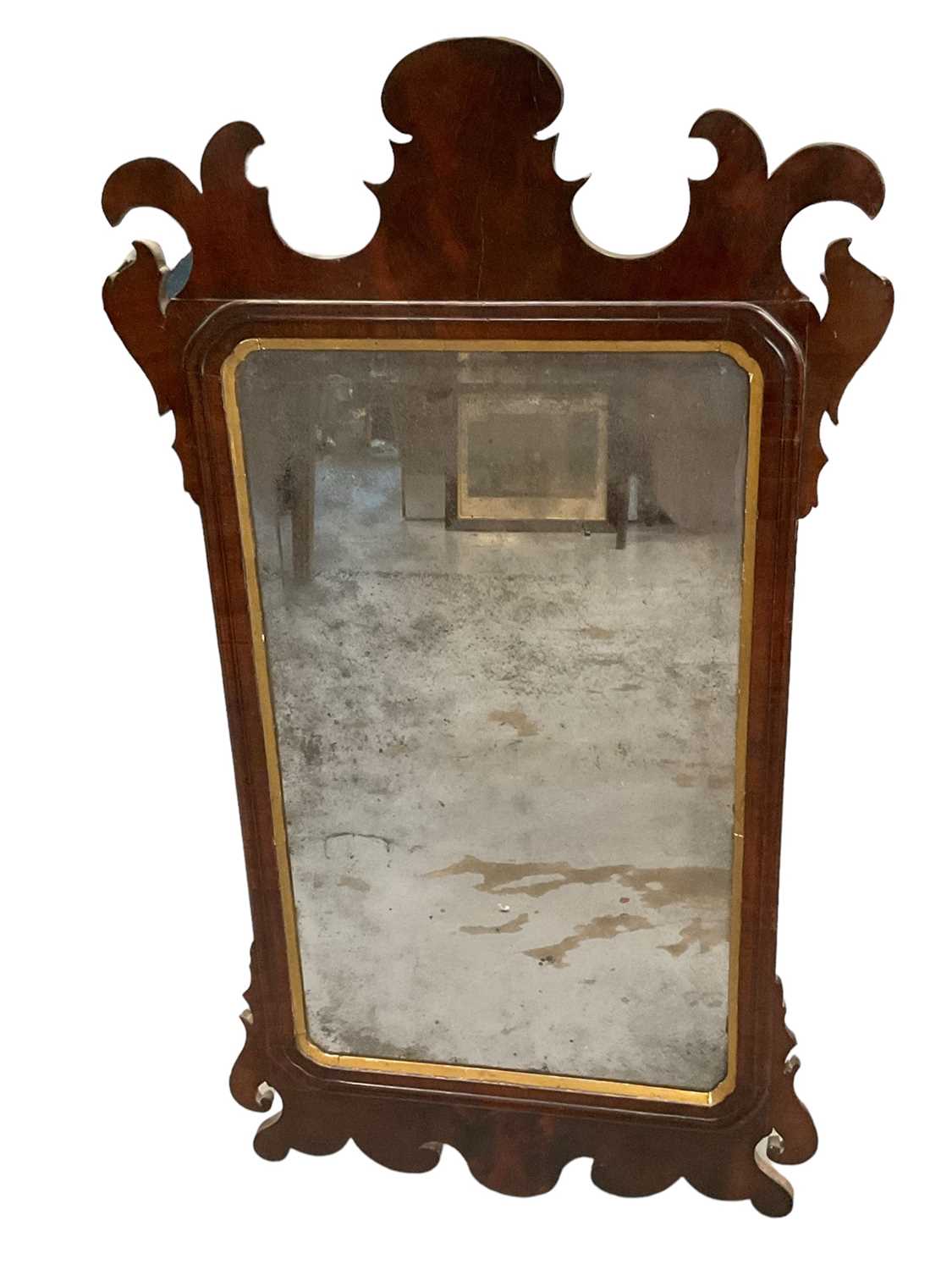 Lot 1283 - 18th century walnut fret carved wall mirror