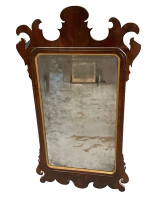 Lot 1283 - 18th century walnut fret carved wall mirror