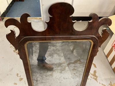 Lot 1283 - 18th century walnut fret carved wall mirror