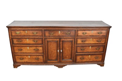 Lot 1303 - George III oak and fruitwood crossbanded dresser base