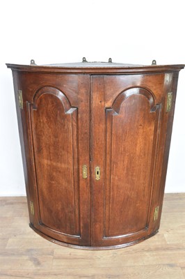 Lot 1305 - George III bowfront hanging corner cupboard