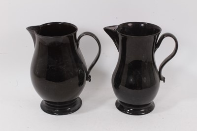 Lot 1312 - Two large 18th century jackfield jugs