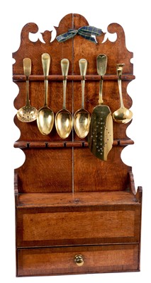 Lot 1362 - Regency oak and fruitwood crossbanded spoon rack, with brass spoons and fish slice