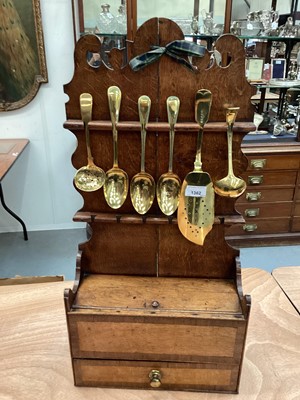 Lot 1362 - Regency oak and fruitwood crossbanded spoon rack, with brass spoons and fish slice