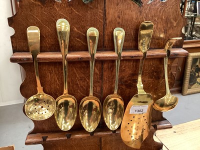 Lot 1362 - Regency oak and fruitwood crossbanded spoon rack, with brass spoons and fish slice