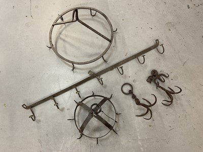 Lot 1383 - Antique wrought iron hanging game rack, and two other racks