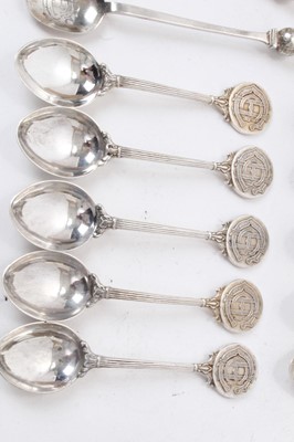 Lot 224 - 16 silver spoons and sugar tongs and three silver brushes