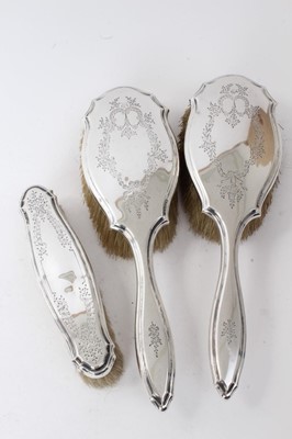 Lot 224 - 16 silver spoons and sugar tongs and three silver brushes