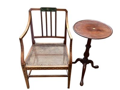 Lot 1246 - Georgian mahogany wine table with circular top on turned column and tripod base, together with a satin wood elbow chair with cane seat (2)