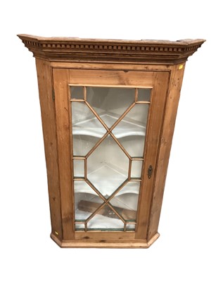 Lot 1252 - Antique pine corner cupboard with shaped shelves enclosed by astragal glazed door, 70cm wide, 108cm high