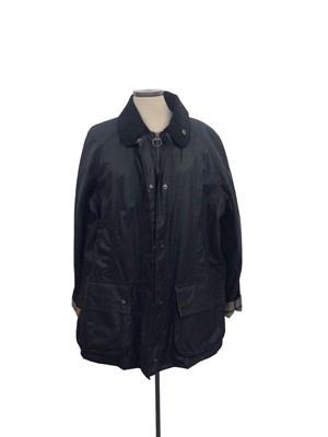 Lot 2067 - Barbour women's Beadnell navy waxed jacket size 16 with tags. Retail price on label £239