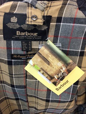 Lot 2067 - Barbour women's Beadnell navy waxed jacket size 16 with tags. Retail price on label £239