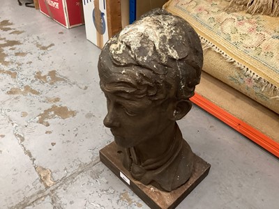 Lot 653 - Cold cast bronze (resin) bust of a boy on a wooden base, with label to base, 45cm high