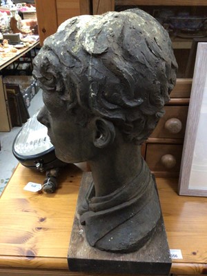 Lot 653 - Cold cast bronze (resin) bust of a boy on a wooden base, with label to base, 45cm high