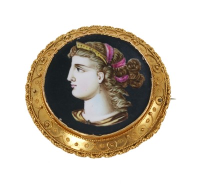 Lot 300 - Victorian Etruscan Revival brooch with painted porcelain panel depicting a female bust