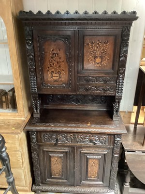 Lot 1271 - Victorian carved oak two height bookcase with two marquetry inlaid panelled doors and two short drawers above, single drawer and two panelled doors below