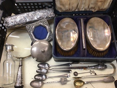 Lot 1107 - Silver backed brushes, silver photograph frame, silver mounted glass bottle, various silver teaspoons and other silver flatware