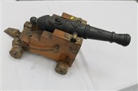 Lot 2527 - Decorative iron signalling cannon with lion...