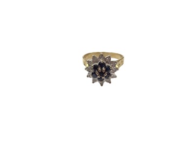 Lot 1109 - 1970s 18ct gold sapphire and diamond flower head cluster ring