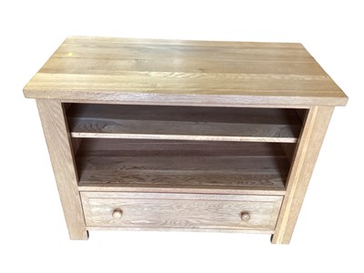 Lot 1317 - Modern light oak television/multi media stand with open shelf and drawer below, 90cm wide, 45cm deep, 67cm high, together with a blanket box (2)