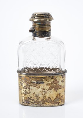 Lot 151 - Edwardian cut glass spirit flask with silver gilt mounts