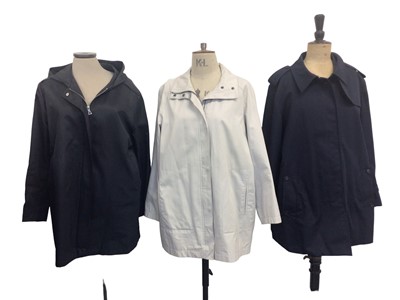 Lot 2072 - Womens navy 3/4 trench style jacket, size 18, light weight cream jacket, size 14, navy rain jacket size large regular and a navy light weight coat size 16 regular, all by Aquascutum