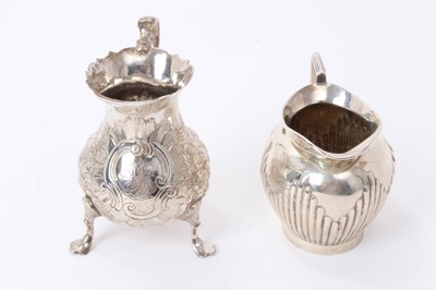 Lot 159 - George II silver cream jug of baluster form, with embossed floral decoration