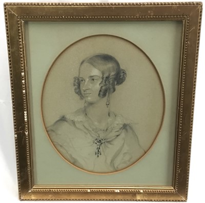 Lot 94 - Early Victorian portrait study of a young lady, graphite heightened in white chalk. Signed and dated 1840 lower right. In gilt frame with oval mount. Overall including frame 40.5x35cm