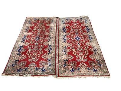 Lot 1334 - Pair of red rugs, 207cm x 93cm