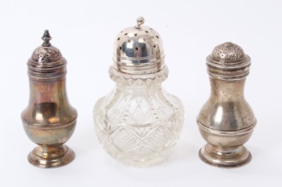 Lot 160 - George II silver caster of baluster form with pierced domed cover (London 1735) and two others