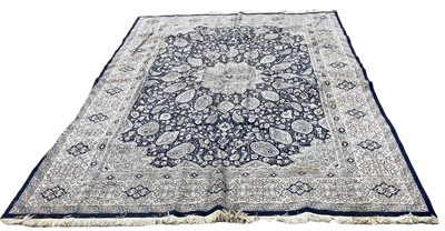 Lot 1337 - Large Kerman rug with central medallion on blue, cream and pink ground, 330cm x 220cm