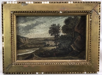 Lot 59 - 17th or 18th century British School. Oil on board, figure walking through an extensive landscape with trees and mountains in the background. In gilt frame. Overall including frame 17x23cm