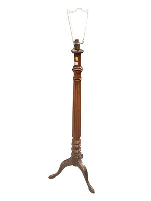 Lot 1373 - Mahogany standard lamp with receded column and three splayed legs