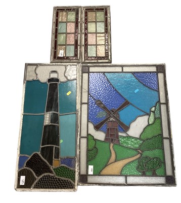 Lot 482 - Group of four stained glass windows, including one depicting, a windmill, and one depicting a lighthouse (4).