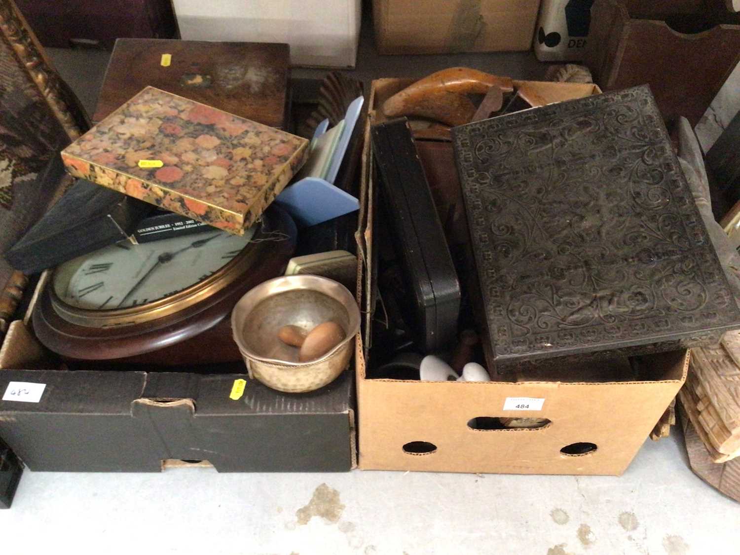 Lot 484 - Two boxes of sundry items to include clock, silver plate, wood carvings and others.