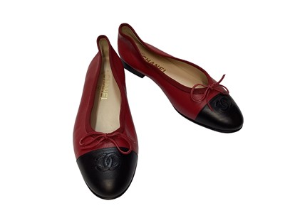 Lot 2081 - Chanel shoes in red leather with CC logo on black toe cap with soft dust bags.  Size 36 1/2.  Very slight wear on heel edge and toe cap edge, uppers very good condition.