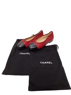 Lot 2081 - Chanel shoes in red leather with CC logo on black toe cap with soft dust bags.  Size 36 1/2.  Very slight wear on heel edge and toe cap edge, uppers very good condition.