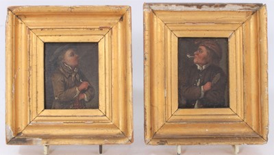 Lot 599 - Pair of 18th century small Dutch oil on panel portraits of smoking men, in gilt frames