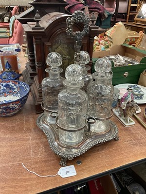 Lot 507 - 19th century silver plated four bottle decanter stand with four decanters.