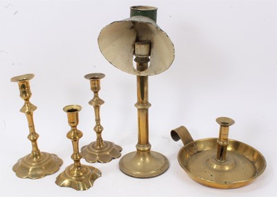 Lot 613 - Three brass Queen Anne candlesticks, two others