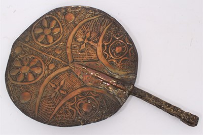 Lot 622 - Unusual tribal embossed copper fan