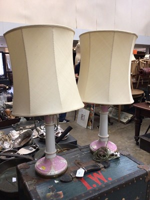 Lot 565 - Pair of pink and gilt porcelain lamps, 60cm high