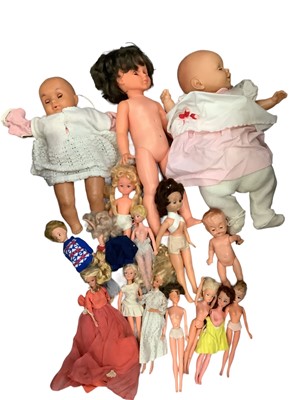 Lot 570 - Box of Dolls to include three large baby dolls, Sindy and Barbie and clothing