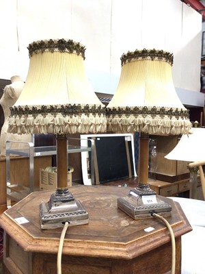 Lot 571 - Pair of lamps with silver weighted bases, converted from candlesticks, 39cm high