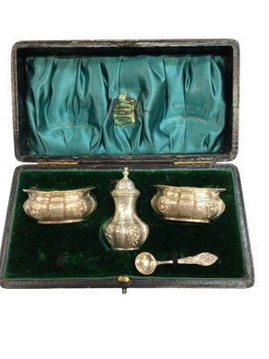 Lot 1131 - Silver part cruet set, Birmingham 1901, with scrollwork decoration in relief