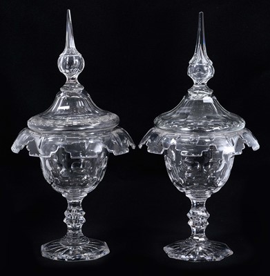 Lot 4 - Pair of 19th century cut glass sweetmeats and covers, the covers with pointed knops, the glasses with downturned crenellated rims and teardrop stems, 32cm high