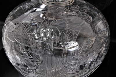 Lot 7 - A pair of late 19th Century Stourbridge clear crystal glass decanters, possibly Thomas Webb & Sons, the body polished intaglio engraved with fish swimming above a scallop shell, 31cm high