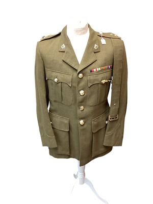 Lot 687 - Royal Army Service Corps Captains Service Dress jacket, together with a Police jacket and various R.A.F uniform in a canvas bag.