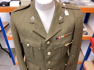 Lot 687 - Royal Army Service Corps Captains Service Dress jacket, together with a Police jacket and various R.A.F uniform in a canvas bag.