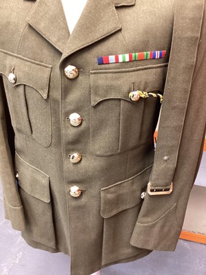 Lot 687 - Royal Army Service Corps Captains Service Dress jacket, together with a Police jacket and various R.A.F uniform in a canvas bag.